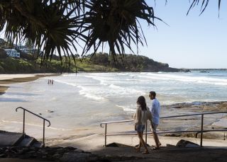 Couple enjoying a day out at Yamba Main Beach, Yamba