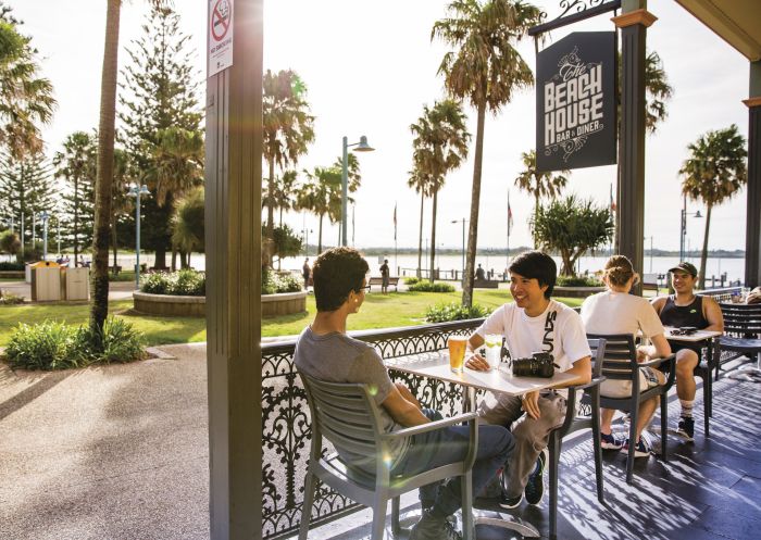 Friends enjoying afternoon drinks at The Beach House Restaurant and Bar in Port Macquarie, North Coast