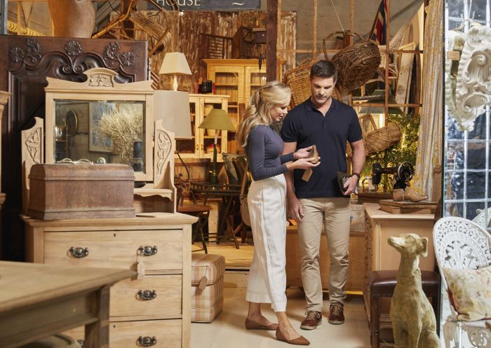 Couple browsing for antiques at Dirty Janes antique market in Bowral, Southern Highlands