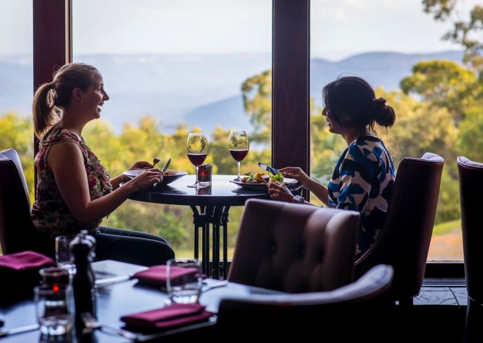 Women enjoying food and drink at Embers Restaurant inside the Fairmont Resort & Spa, Leura in the Blue Mountains