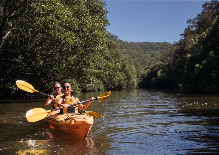 Couple enjoying a day of kayaking on Popran Creek, Glenworth Valley