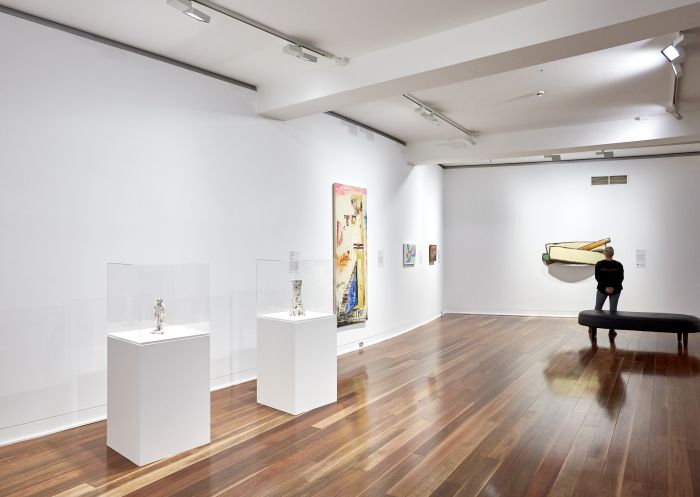 Visitor enjoying the artwork on exhibition at the Wollongong Art Gallery in Wollongong, South Coast