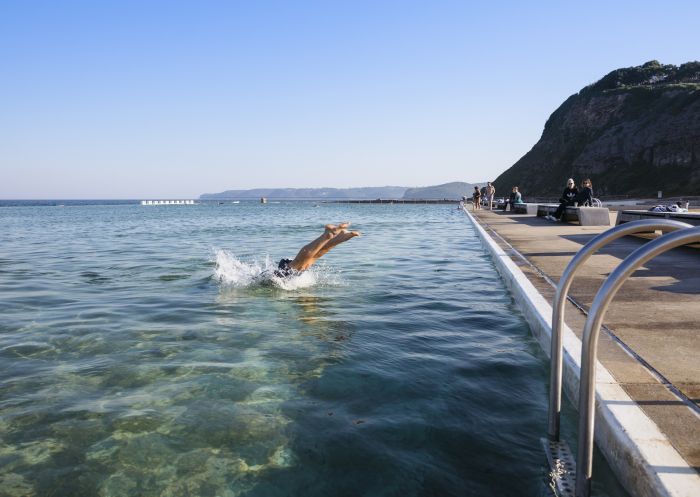 People relaxing at Merewether's Ocean Baths in Newcastle, North Coast