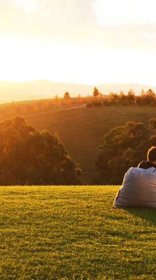 Family watching the sun setting over the hills of Mudgee