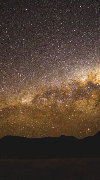 The starry Milky Way above the volcanic silhouette, Warrumbungles