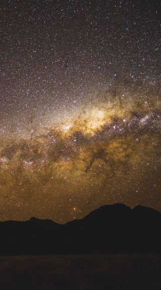 The starry Milky Way above the volcanic silhouette, Warrumbungles