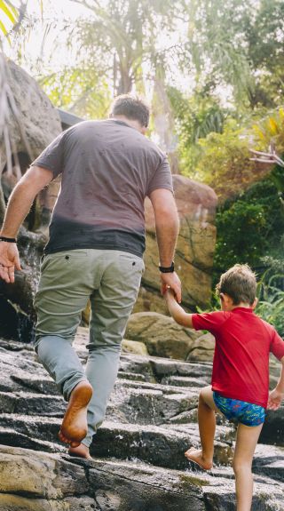 Father and son enjoying the Shipwreck Island Waterpark at BIG4 NRMA South West Rocks Holiday Park, South West Rocks