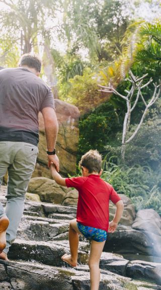 Father and son enjoying the Shipwreck Island Waterpark at BIG4 NRMA South West Rocks Holiday Park, South West Rocks