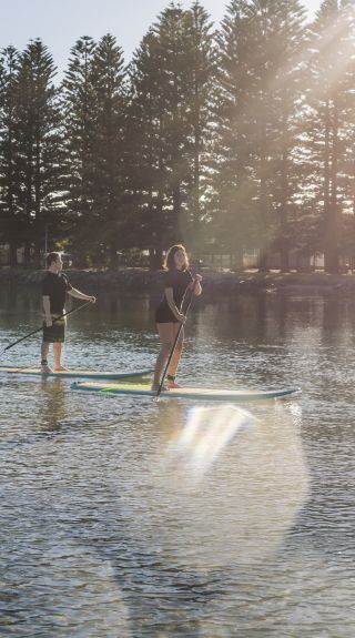 Stand-up paddleboarding on Lake Illawarra in Shellharbour