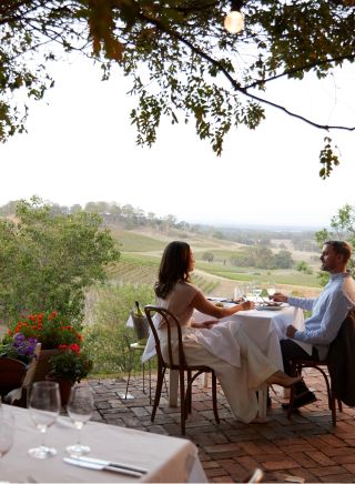 Couple enjoying food and drink at Bistro Molines, Mount View