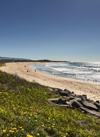 People enjoying a warm day at Corrimal Beach. north of Wollongong