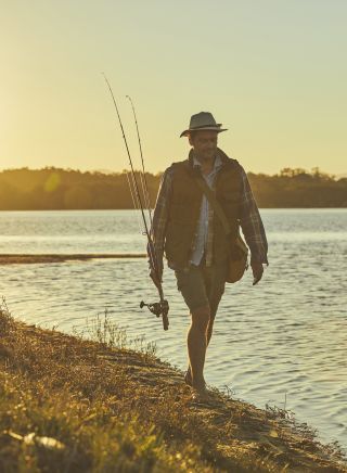 Man fishing in Tuross River in Tuross Heads, South Coast