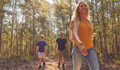 Family enjoying a walk through bushland in Mogo, Eurobodalla, South Coast