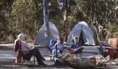 Family enjoying a morning campfire in Dunns Swamp - Ganguddy Picnic and Camping Area, Wollemi National Park, Country NSW