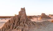 Man taking photographs of the Walls of China in Mungo National Park, Mungo