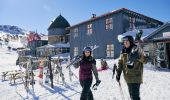 A couple heading out to ski at Charlottes Pass in the Snowy Mountains