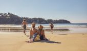 Family enjoying a visit to McKenzies Beach, Malua Bay