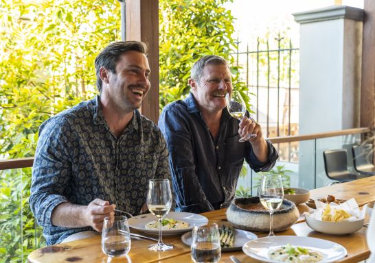 Friends enjoying food and drink at Limone Dining, Griffith